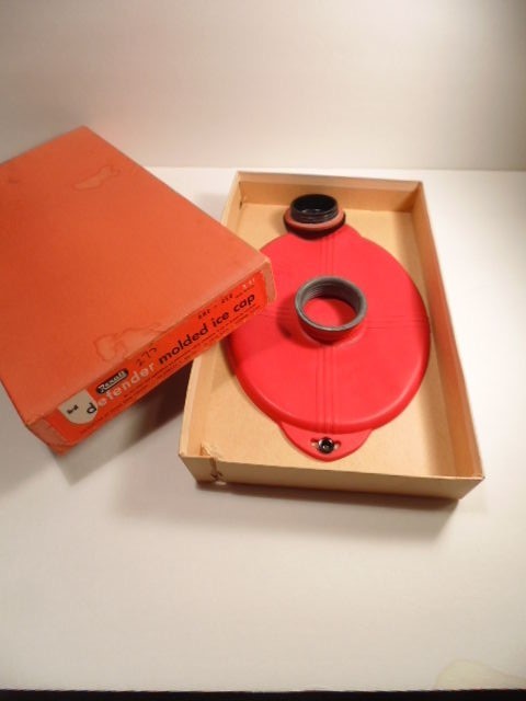 Older Rexall Defender molder rubber ice cap with box