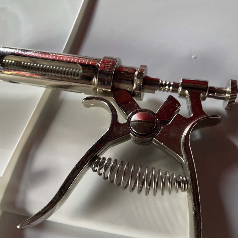 Vintage Metal syringe glass vial 50cc. Incomplete. gallery