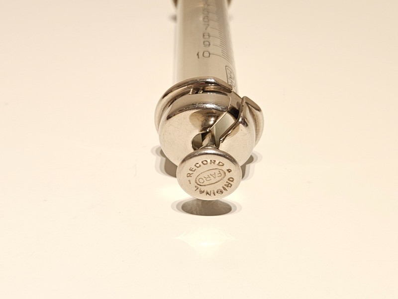 VINTAGE WW2 10cc METAL AND GLASS GERMANY MEDICAL SYRINGE"ORIGINAL RECORD"FARO gallery